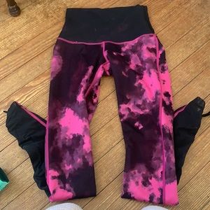 Reversible hot pink/patterned Lululemon leggings with mesh top and bottom